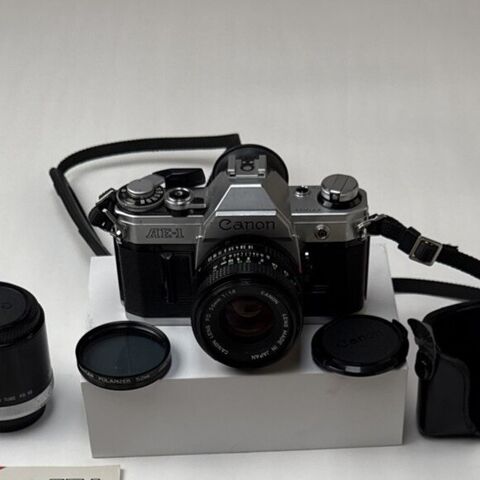 Canon AE-1 35mm film camera with its lens and filters