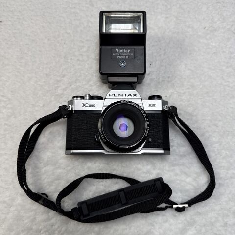 Asahi Pentax K1000 35mm film camera with a flash